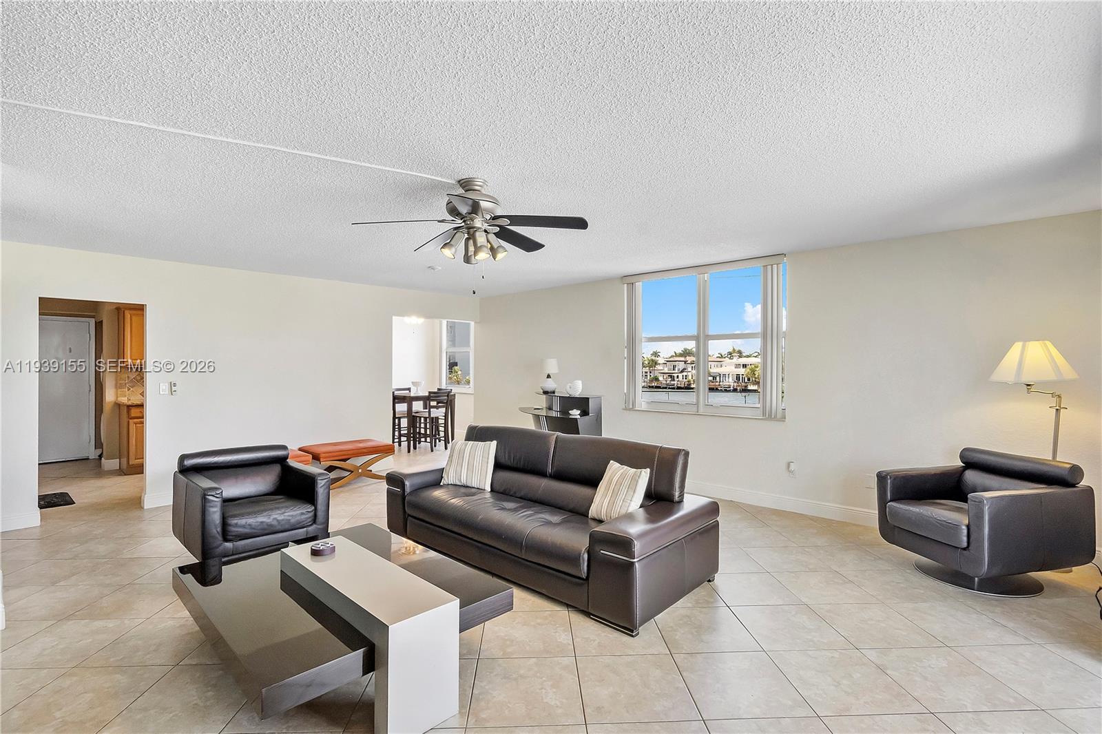 1401 South Ocean Drive, Unit 301 Hollywood, FL 33019 - Photo 15 of 48 a living room with furniture and a lamp