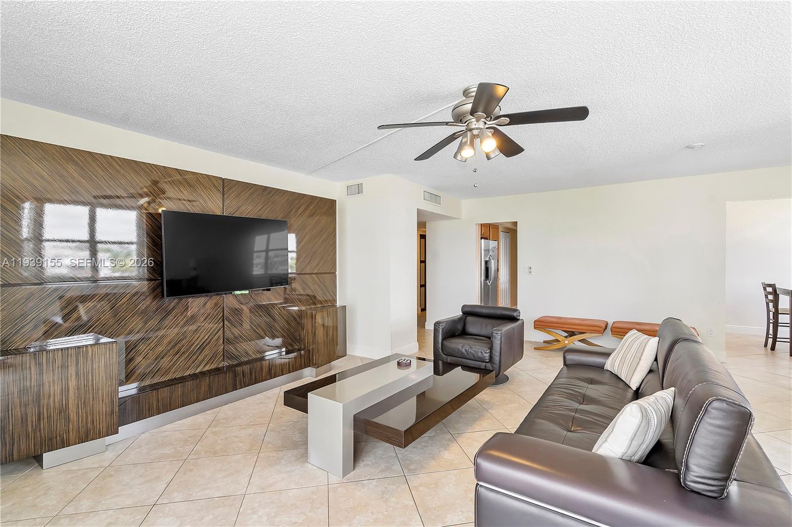 1401 South Ocean Drive, Unit 301 Hollywood, FL 33019 - Photo 16 of 48 a living room with furniture and a flat screen tv