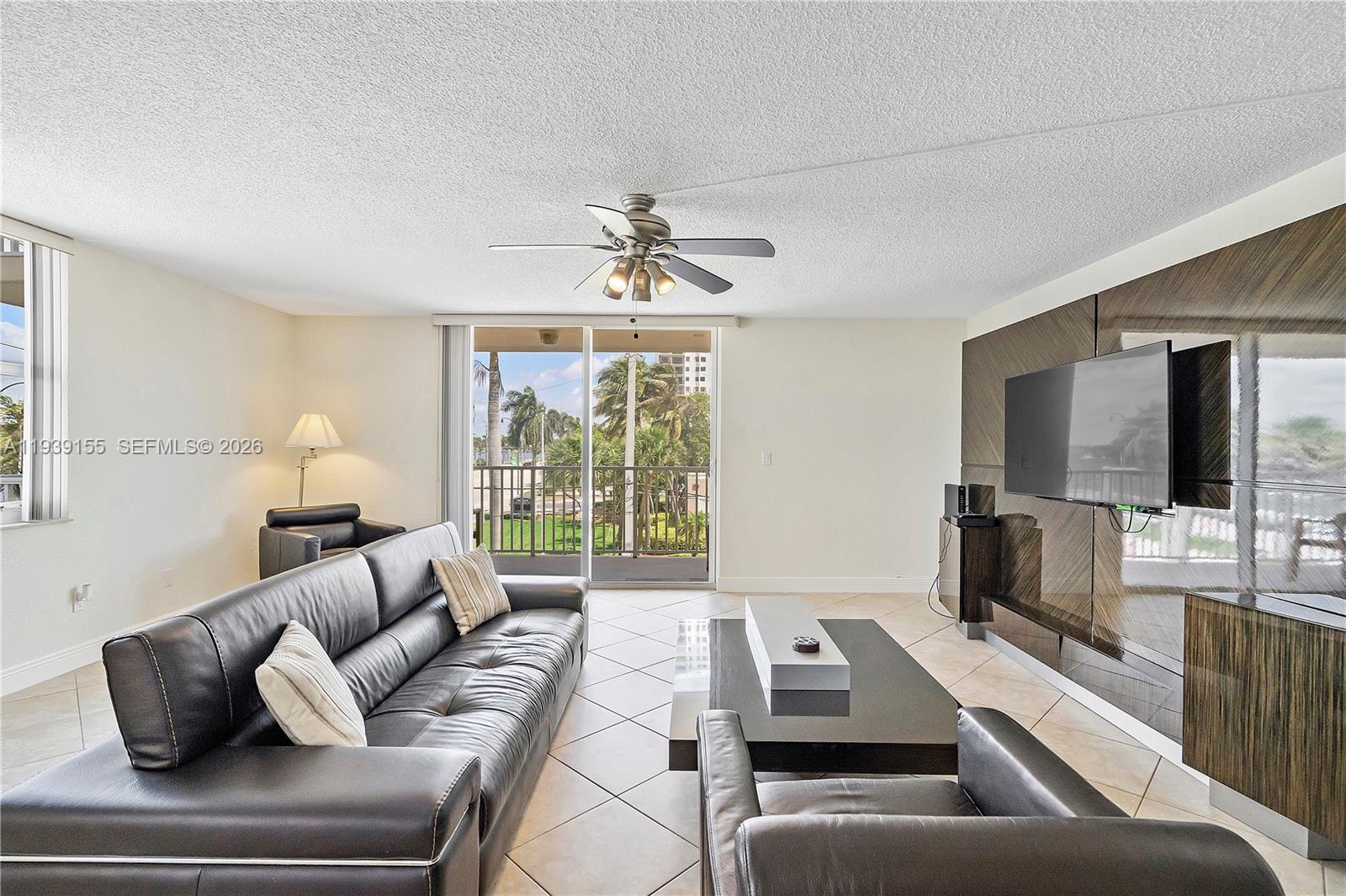 1401 South Ocean Drive, Unit 301 Hollywood, FL 33019 - Photo 17 of 48 a living room with furniture and a flat screen tv