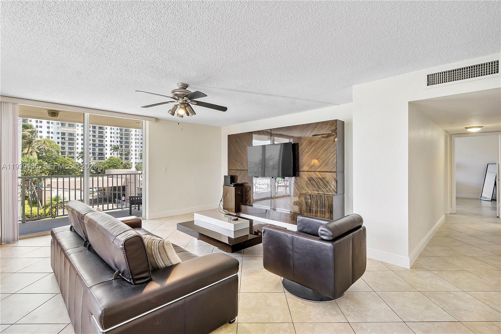 1401 South Ocean Drive, Unit 301 Hollywood, FL 33019 - Photo 18 of 48 a living room with furniture and a large window