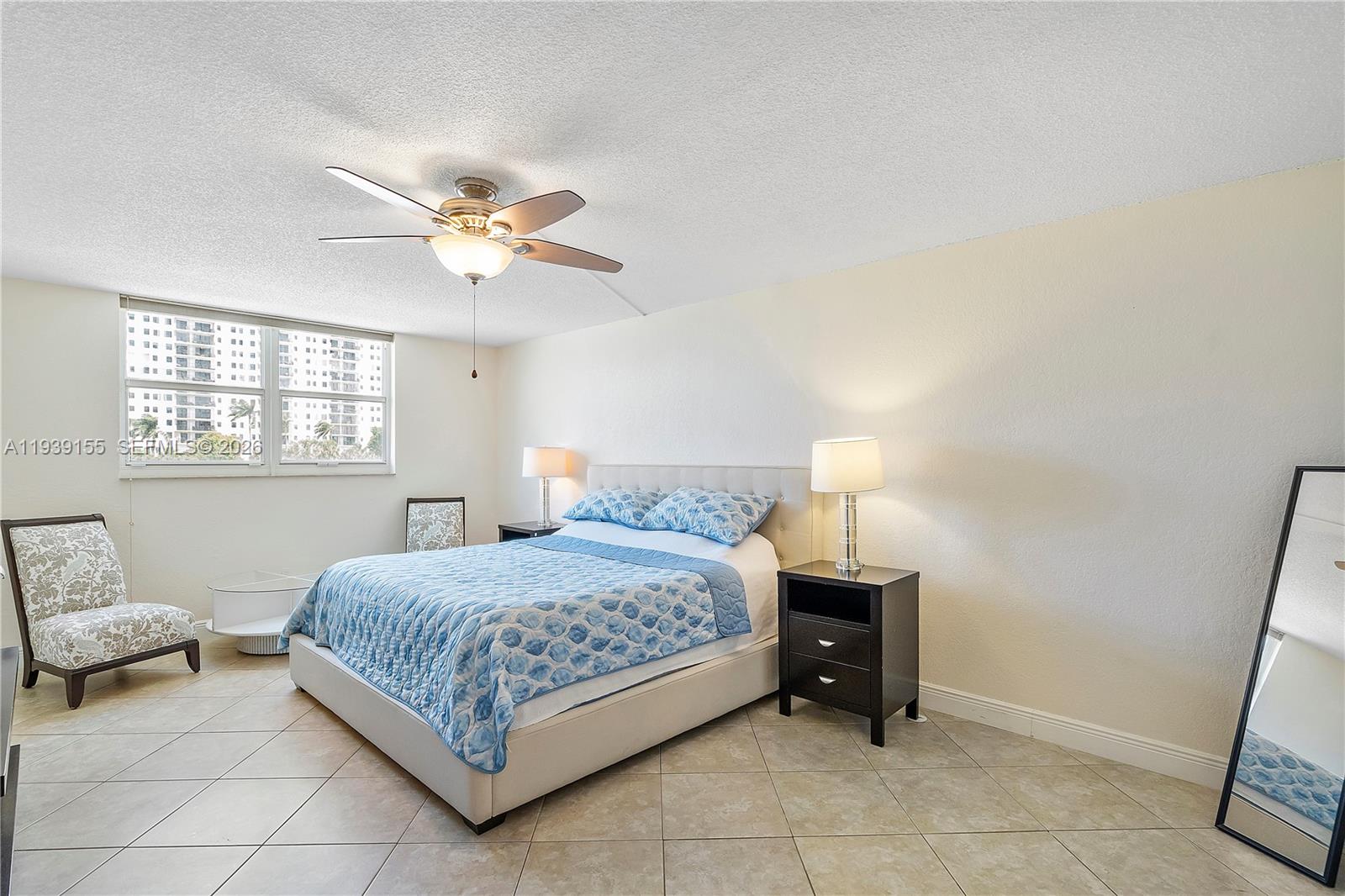 1401 South Ocean Drive, Unit 301 Hollywood, FL 33019 - Photo 22 of 48 a bedroom with a bed and a window