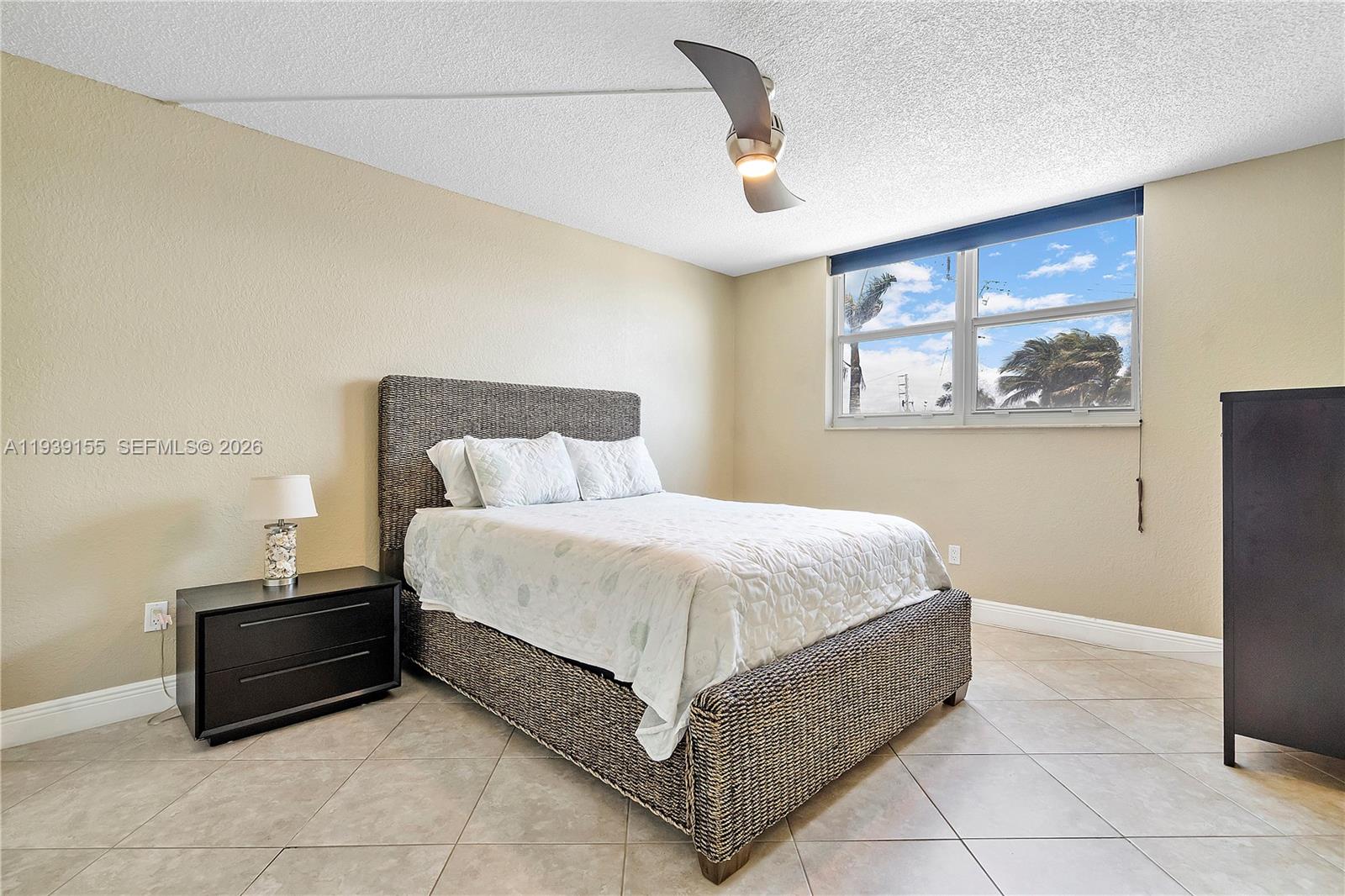 1401 South Ocean Drive, Unit 301 Hollywood, FL 33019 - Photo 25 of 48 a bed room with a bed and a painting on the wall