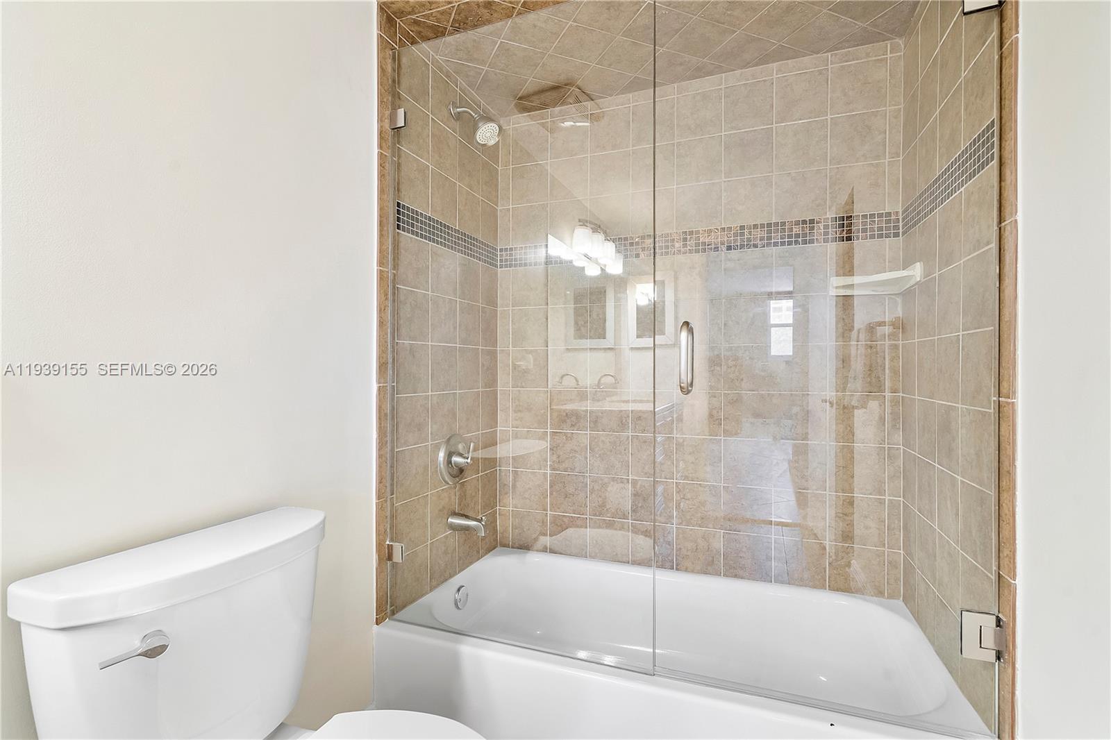1401 South Ocean Drive, Unit 301 Hollywood, FL 33019 - Photo 28 of 48 a bathroom with a shower and a toilet