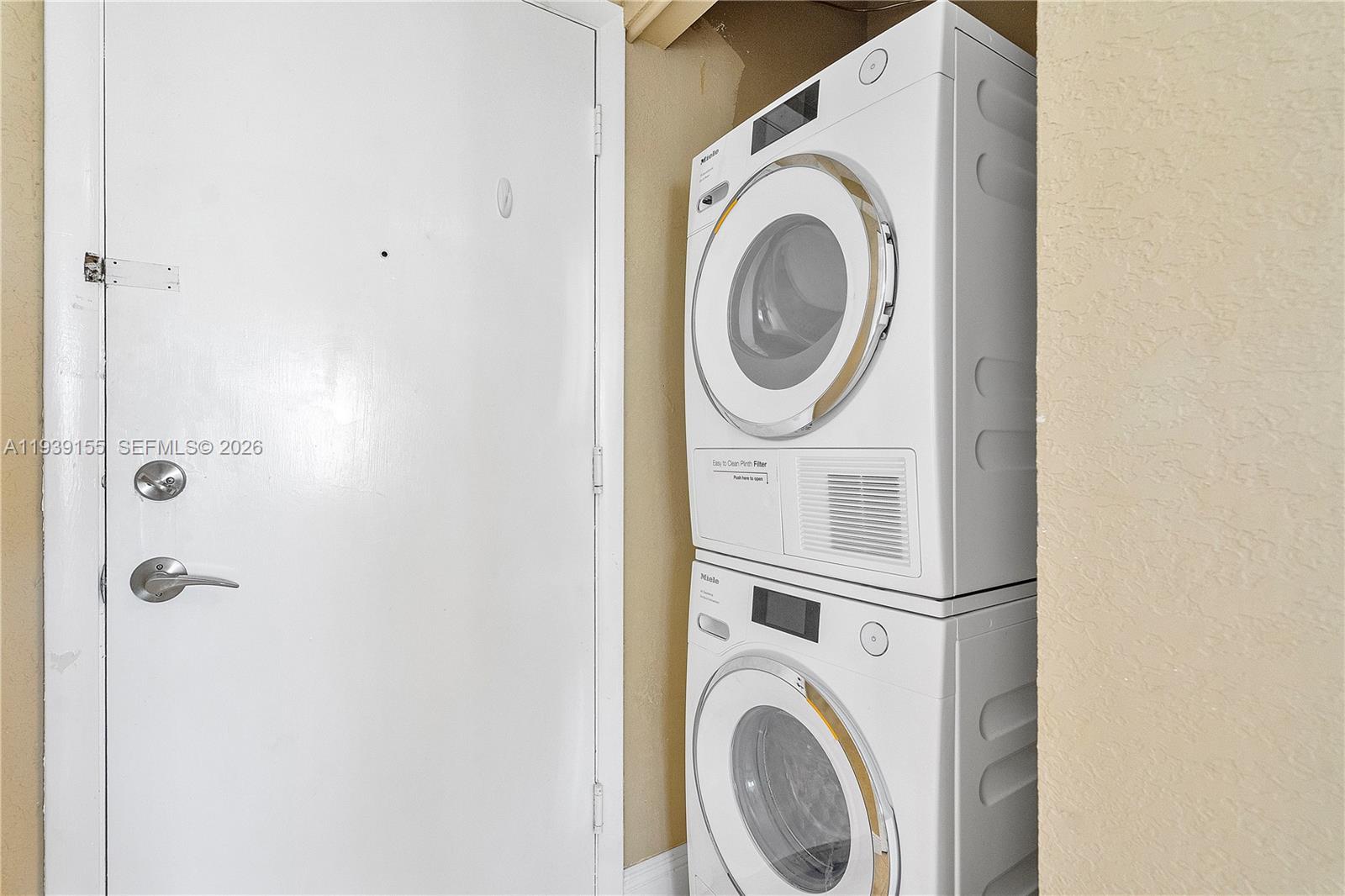 1401 South Ocean Drive, Unit 301 Hollywood, FL 33019 - Photo 29 of 48 a utility room with dryer and washer