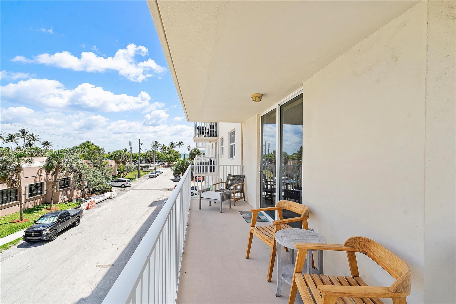 1401 South Ocean Drive, Unit 301 Hollywood, FL 33019 - Photo 31 of 48 a swimming pool with outdoor seating and yard