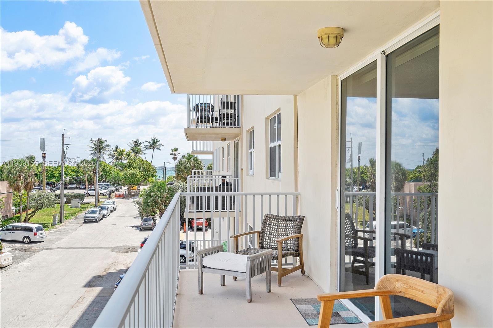 1401 South Ocean Drive, Unit 301 Hollywood, FL 33019 - Photo 32 of 48 a balcony with furniture and city view