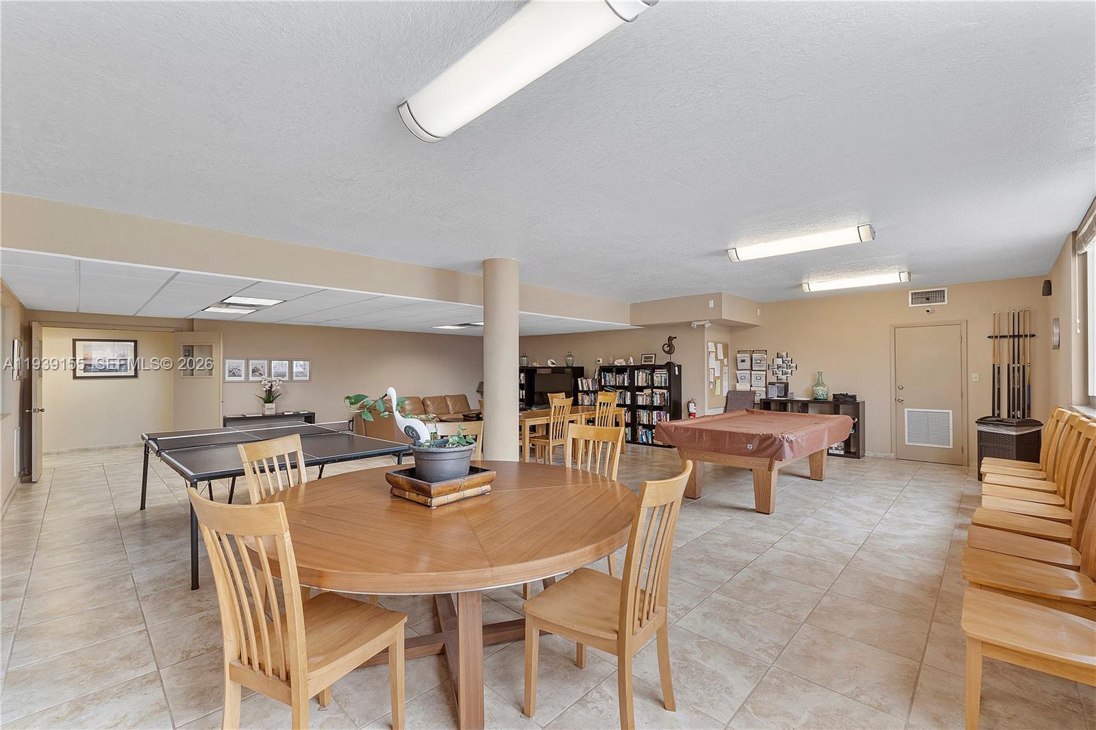 1401 South Ocean Drive, Unit 301 Hollywood, FL 33019 - Photo 37 of 48 a view of a dining room with furniture and wooden floor