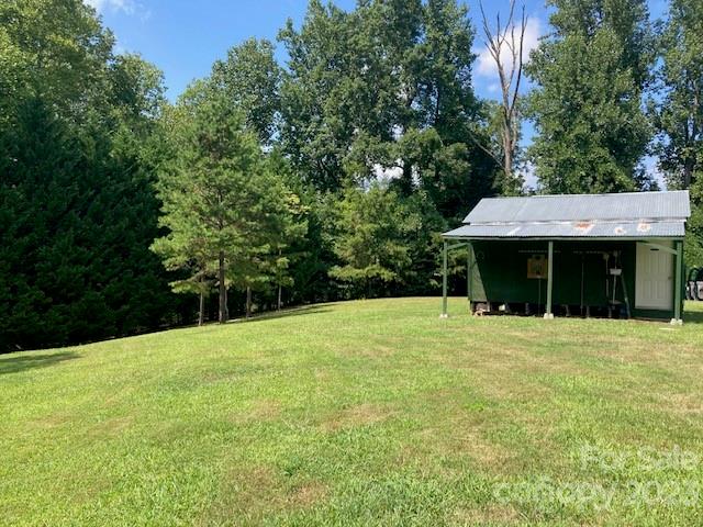 4660 Maple Creek Road Rutherfordton, NC 28139 - Photo 8 of 27 a front view of a house with a garden