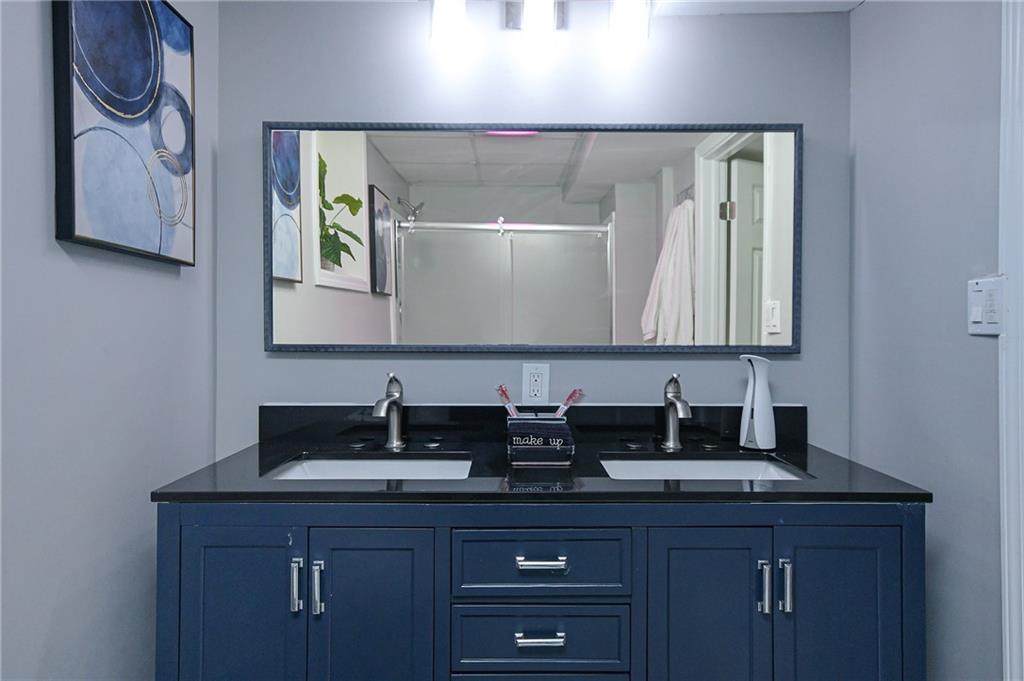 84 West Paulding Boulevard Dallas, GA 30157 - Photo 16 of 37 a bathroom with a sink and a mirror