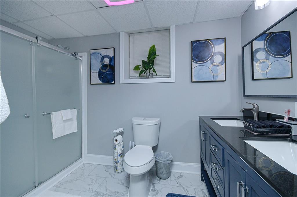 84 West Paulding Boulevard Dallas, GA 30157 - Photo 17 of 37 a bathroom with a toilet a sink and mirror