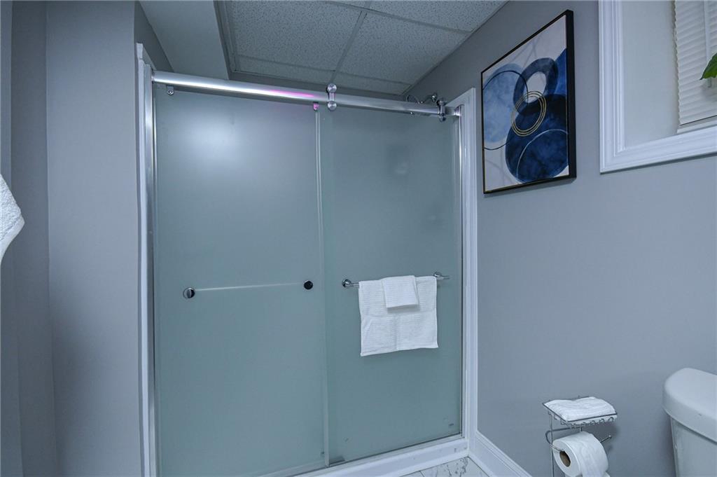 84 West Paulding Boulevard Dallas, GA 30157 - Photo 18 of 37 a bathroom with a shower and toilet