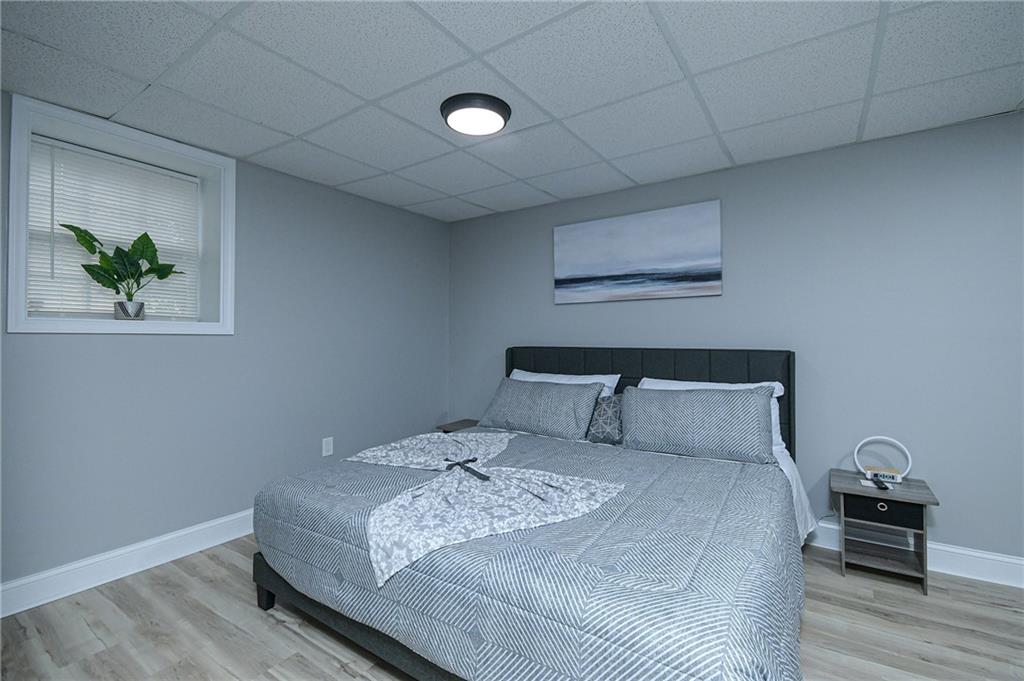 84 West Paulding Boulevard Dallas, GA 30157 - Photo 20 of 37 a bedroom with a bed and a painting on the wall