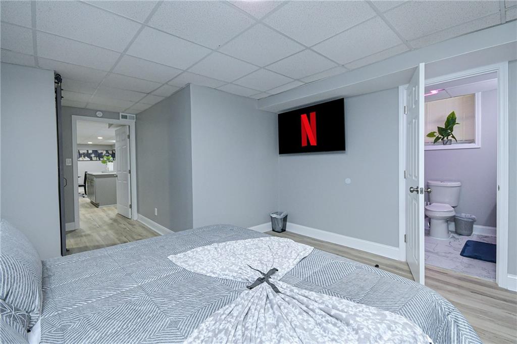 84 West Paulding Boulevard Dallas, GA 30157 - Photo 21 of 37 a bedroom with a bed and a television