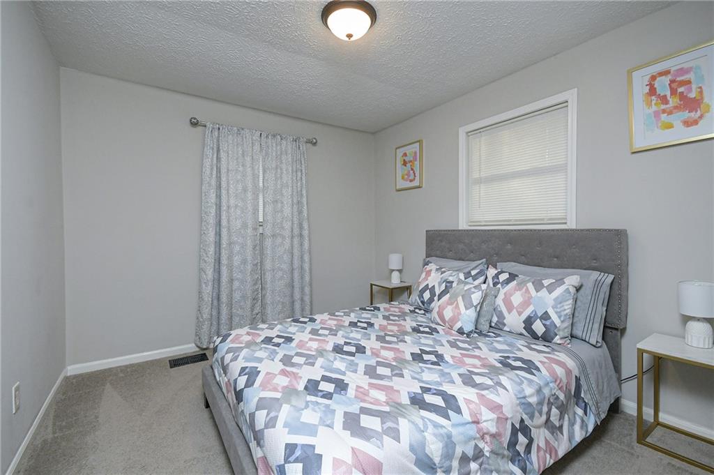 84 West Paulding Boulevard Dallas, GA 30157 - Photo 31 of 37 a bedroom with a bed and a window