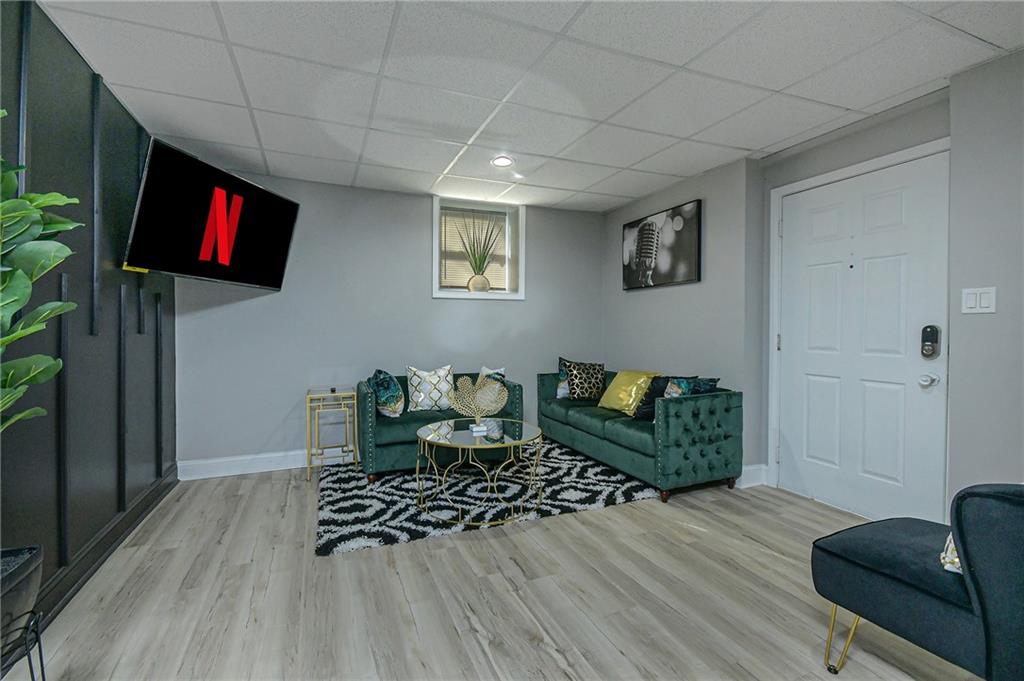 84 West Paulding Boulevard Dallas, GA 30157 - Photo 4 of 37 a living room with furniture and a flat screen tv