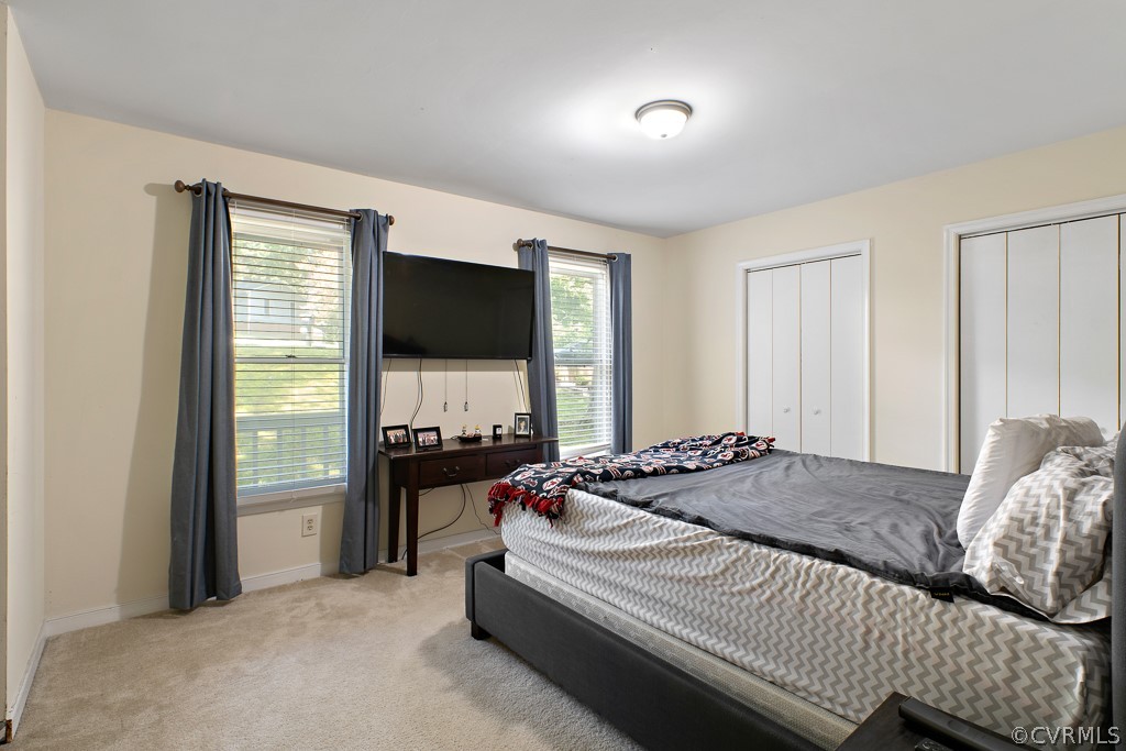 5022 Wilconna Road Chesterfield, VA 23832 - Photo 13 of 27 a bedroom with a bed and a flat tv screen on dresser