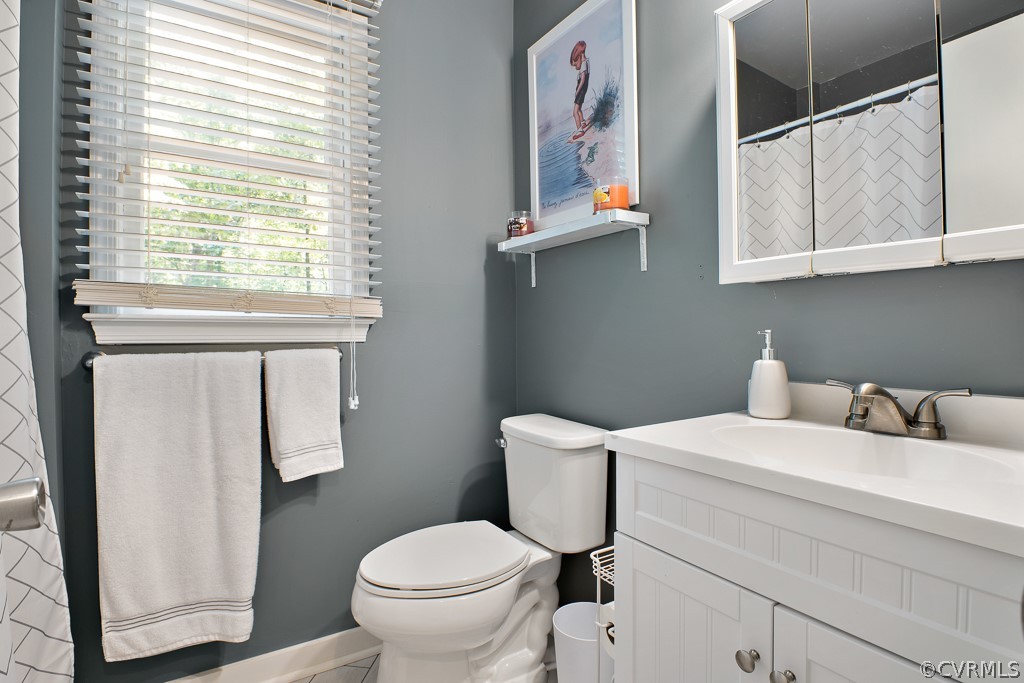 5022 Wilconna Road Chesterfield, VA 23832 - Photo 17 of 27 a bathroom with a toilet sink and mirror