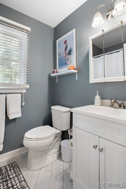 5022 Wilconna Road Chesterfield, VA 23832 - Photo 18 of 27 a bathroom with a toilet sink and mirror