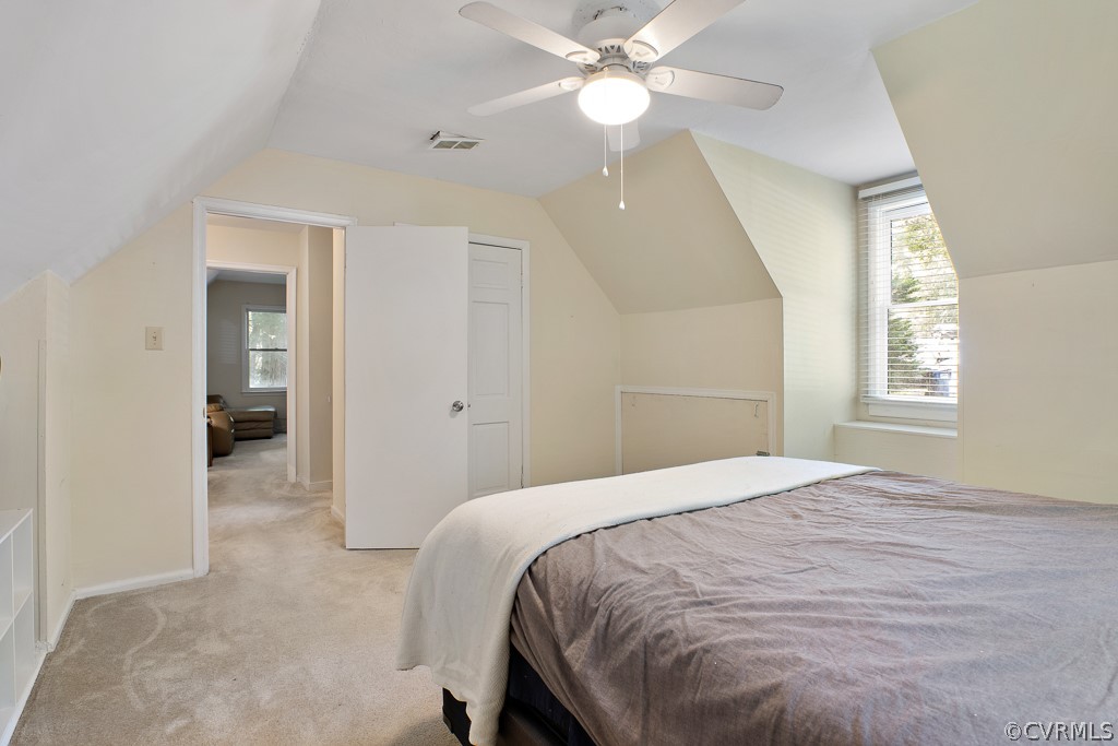 5022 Wilconna Road Chesterfield, VA 23832 - Photo 20 of 27 a bedroom with a large bed and a chandelier