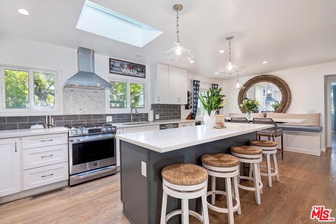 434 West Maple Avenue El Segundo, CA 90245 - Photo 15 of 29 a kitchen with a stove and a view of living room