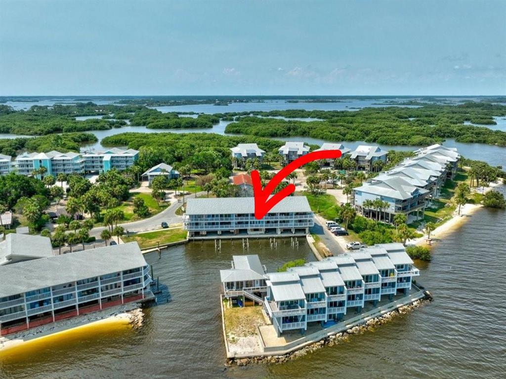 82 2nd Street, Unit D5 Cedar Key, FL 32625 - Photo 1 of 31 a aerial view of a house with a lake view