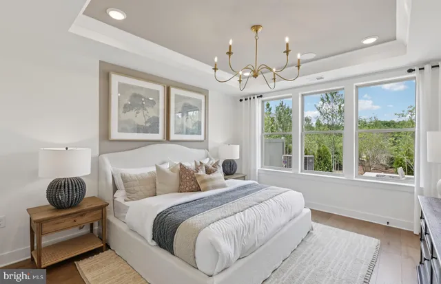 a spacious bedroom with a large bed and a window