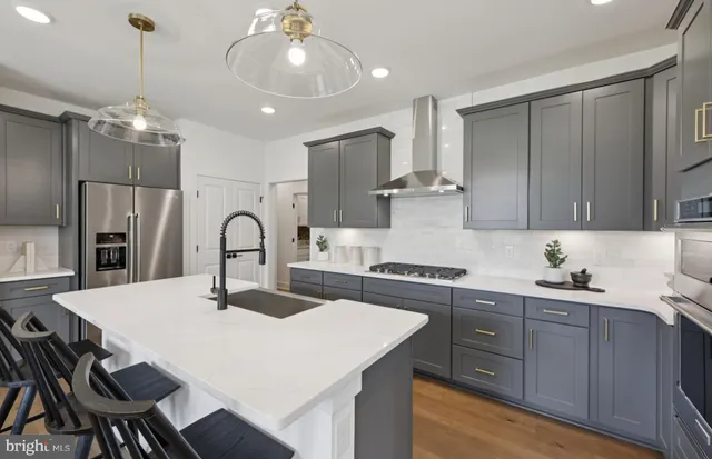 a view of a dining room with furniture and a chandelier
