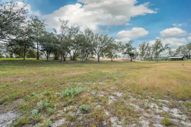 a view of a lake with a house in the background