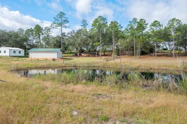 a view of a lake with houses in the back