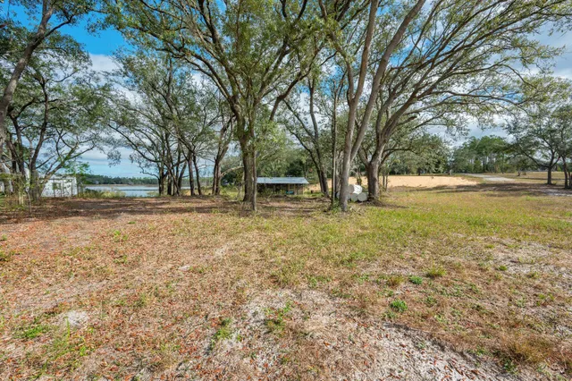 a view of a lake with houses in the back