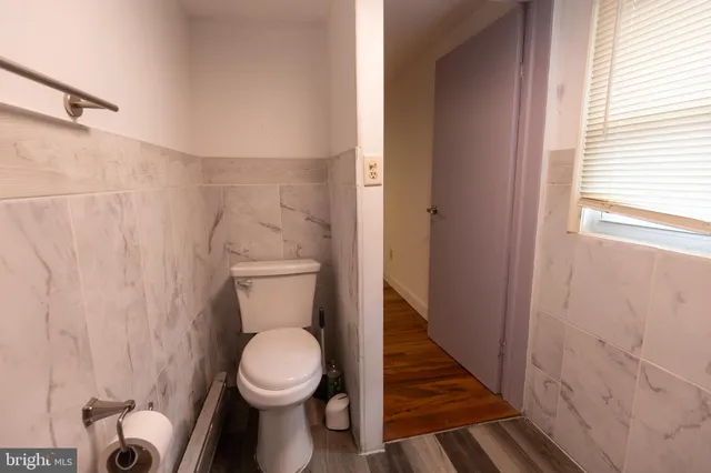 a bathroom with a toilet and a sink