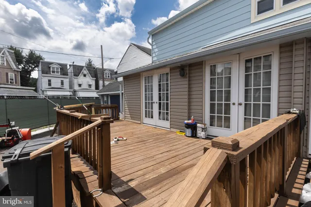 a balcony view with a seating space