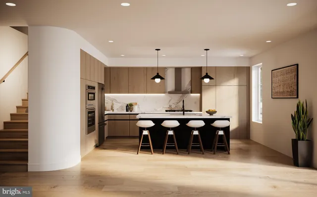 a large kitchen with a table and chairs