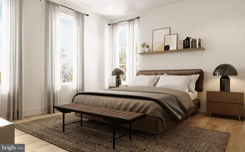 a bedroom with bed and window