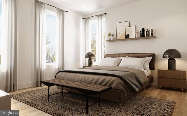 a bedroom with bed and window