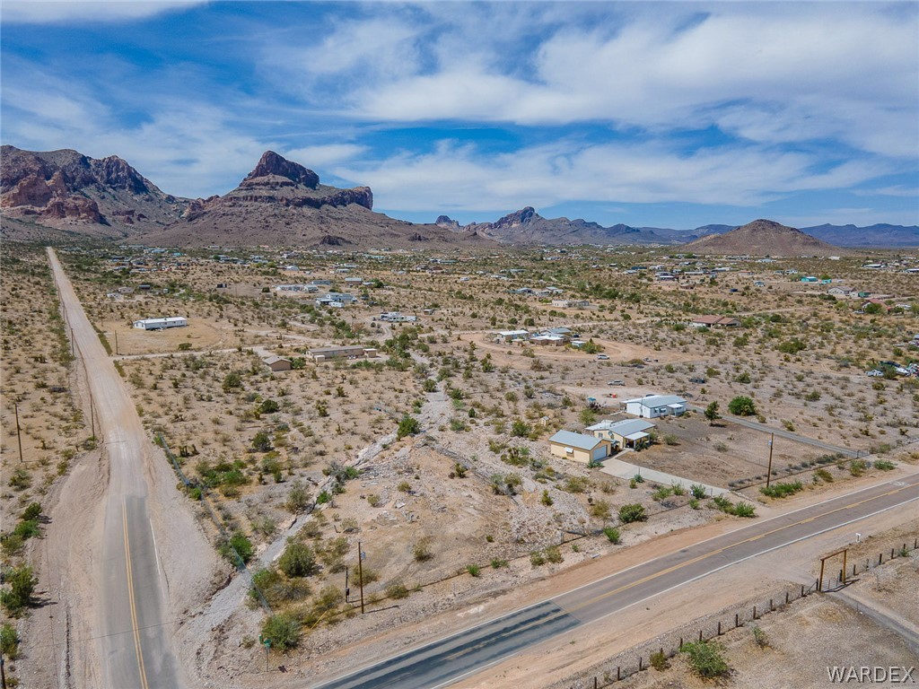 2465 Egar Road Golden Valley, AZ 86413 - Photo 88 of 98 Aerial view showcasing the property's setting within a vast, arid landscape, featuring distant mountains and clear skies