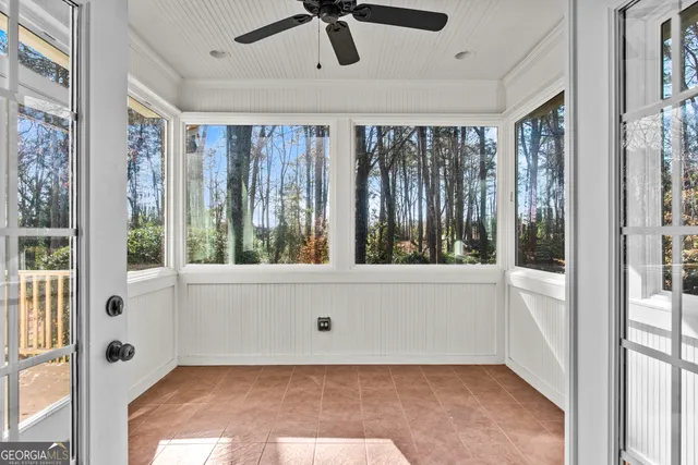 a view of bathroom with tub and windows
