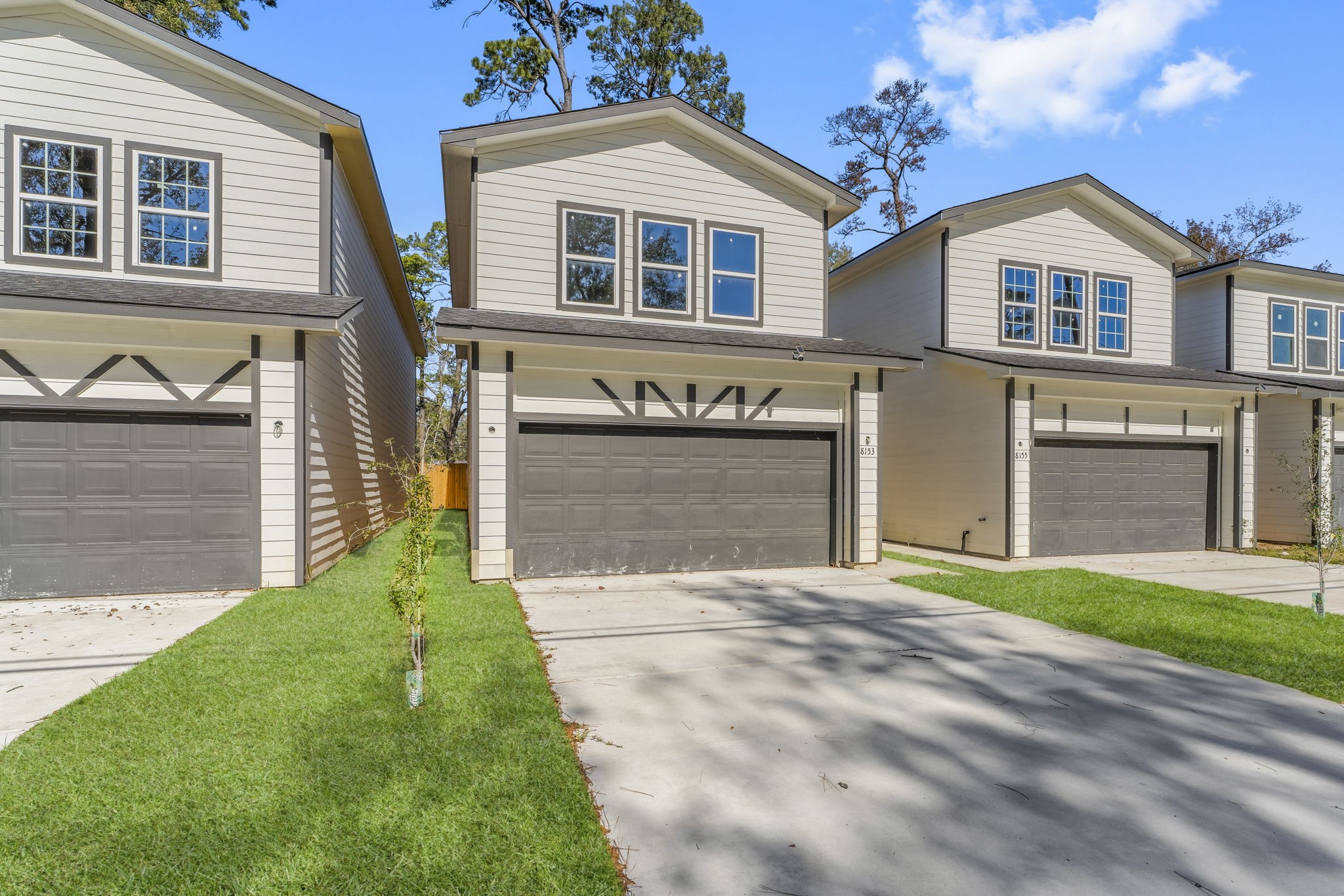 8153 Crestview Drive Houston, TX 77028 - Photo 1 of 27 a front view of a house with a yard and garage