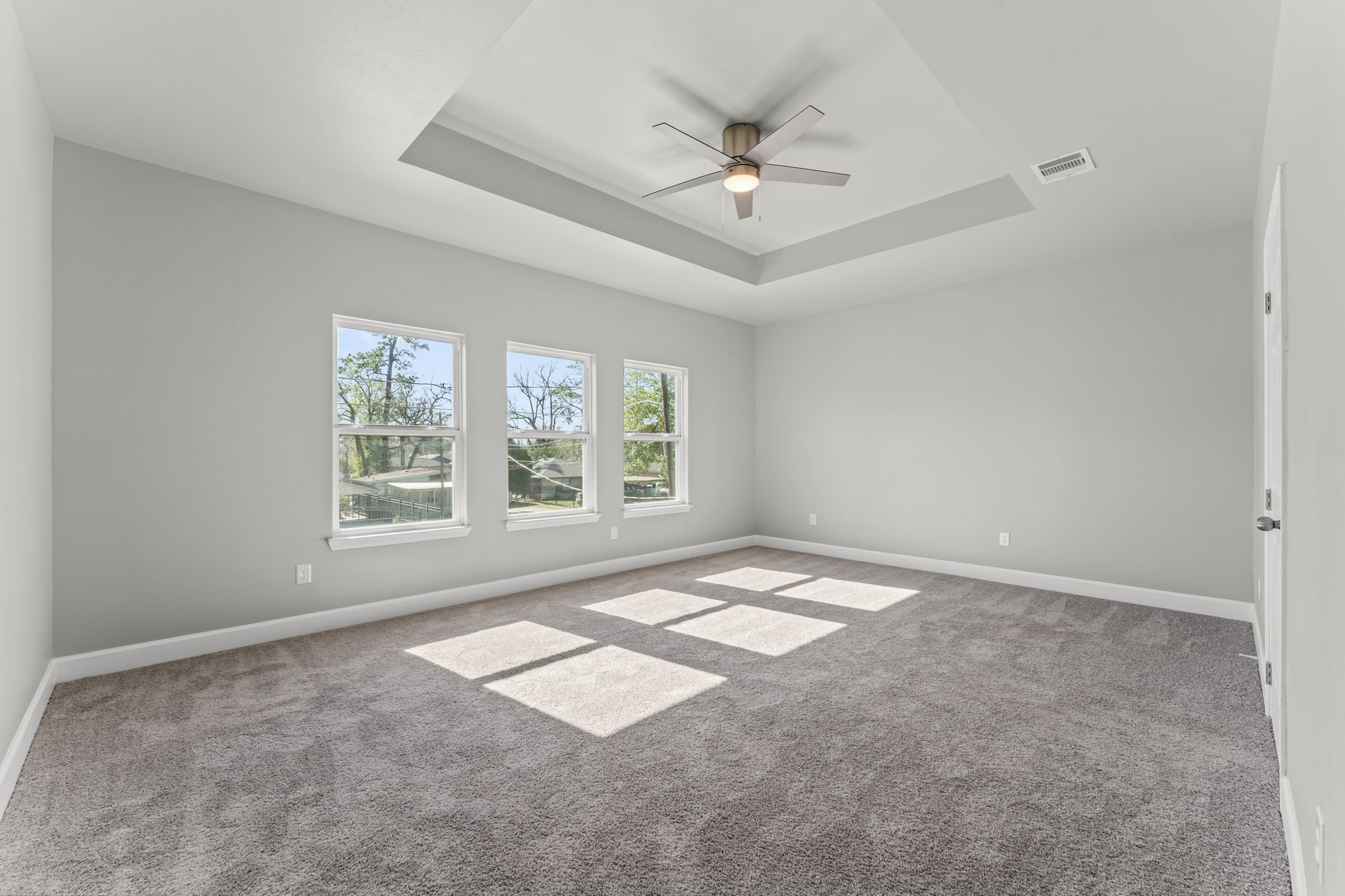 8153 Crestview Drive Houston, TX 77028 - Photo 12 of 27 an empty room with windows and fan