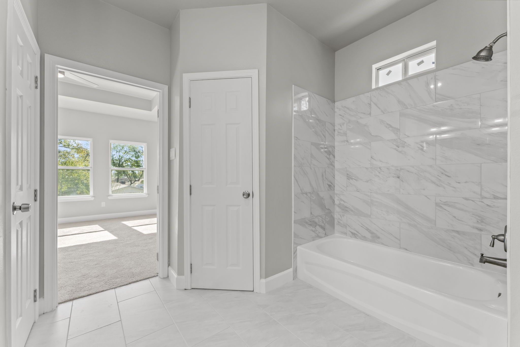 8153 Crestview Drive Houston, TX 77028 - Photo 17 of 27 a bathroom with a bathtub and a shower