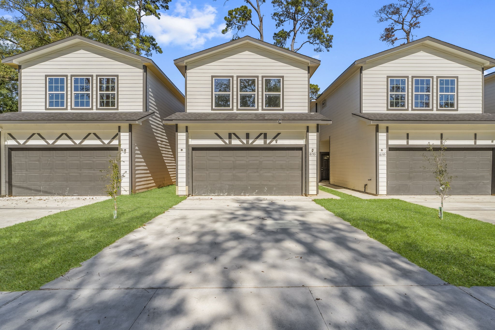 8153 Crestview Drive Houston, TX 77028 - Photo 2 of 27 a front view of a house with a yard and garage