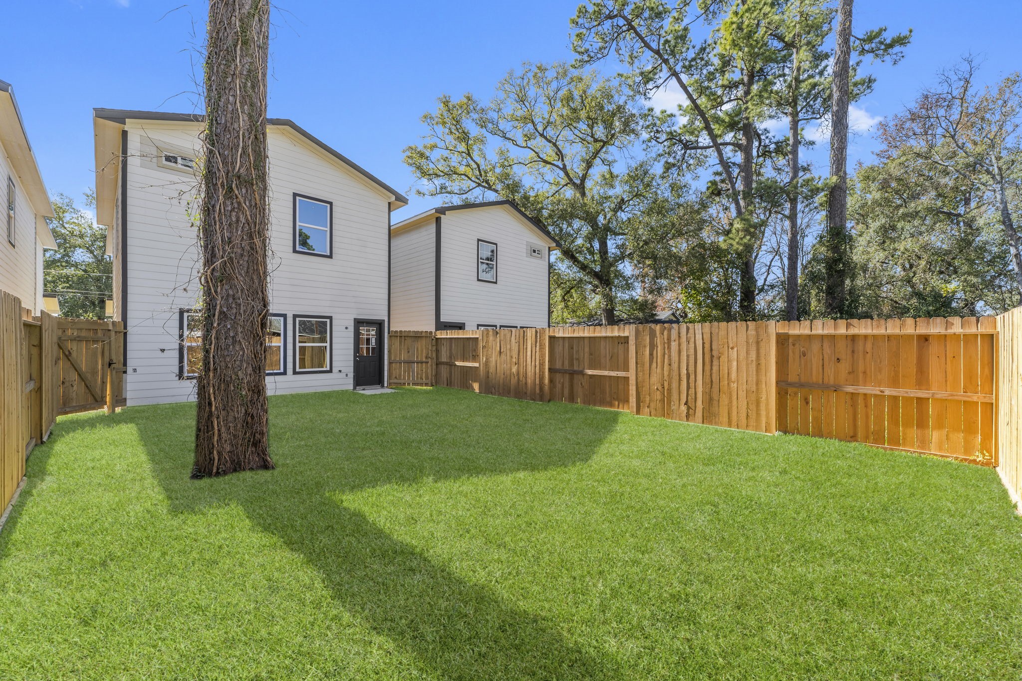 8153 Crestview Drive Houston, TX 77028 - Photo 27 of 27 a view of a house with backyard and a tree