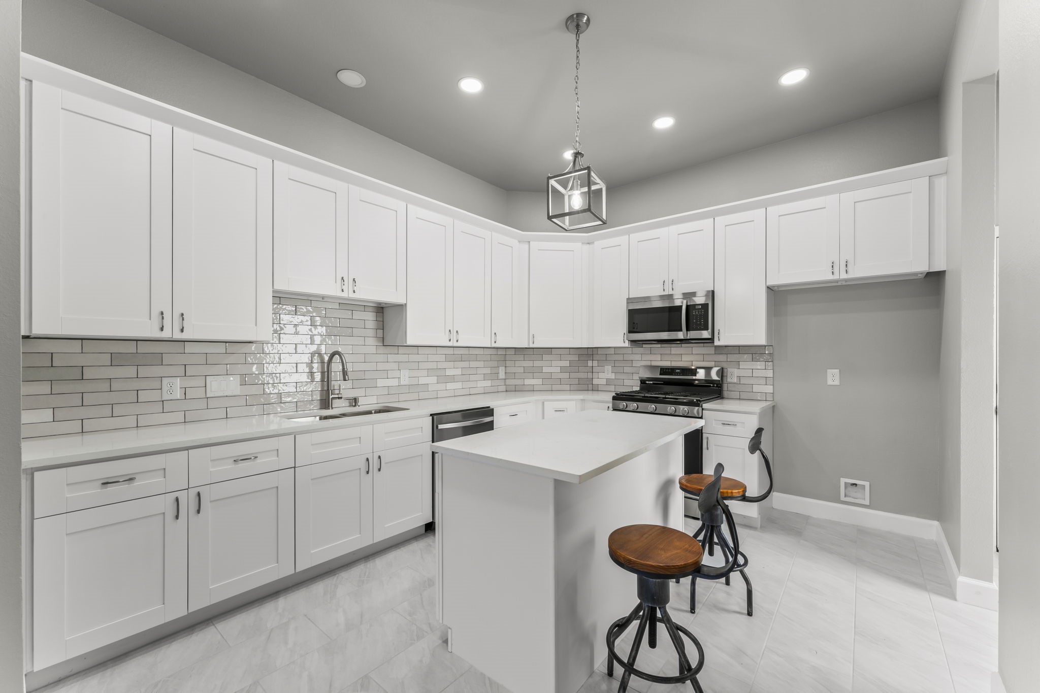 8153 Crestview Drive Houston, TX 77028 - Photo 8 of 27 a kitchen with a sink stainless steel appliances and white cabinets