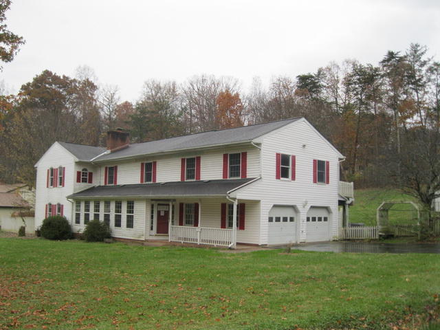 1261 Mountain Pass Road Blue Ridge, VA 24064 - Photo 2 of 23 a view of a house with a yard