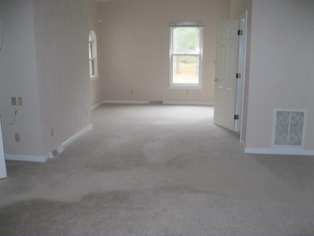 1261 Mountain Pass Road Blue Ridge, VA 24064 - Photo 17 of 23 an empty room with windows