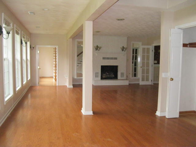 1261 Mountain Pass Road Blue Ridge, VA 24064 - Photo 6 of 23 a view of a livingroom with wooden floor and a fireplace