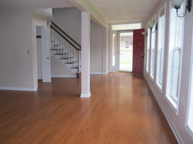 1261 Mountain Pass Road Blue Ridge, VA 24064 - Photo 9 of 23 a view of a hallway with wooden floor and stairs