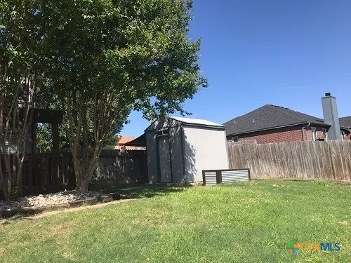 a view of street with trees in front of it