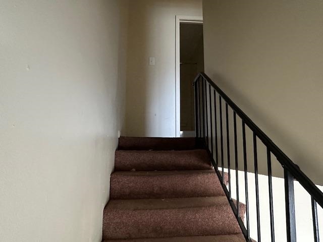 675 Miles, Unit 675 Memphis, TN 38111 - Photo 7 of 9 a view of staircase with wooden floor and white walls