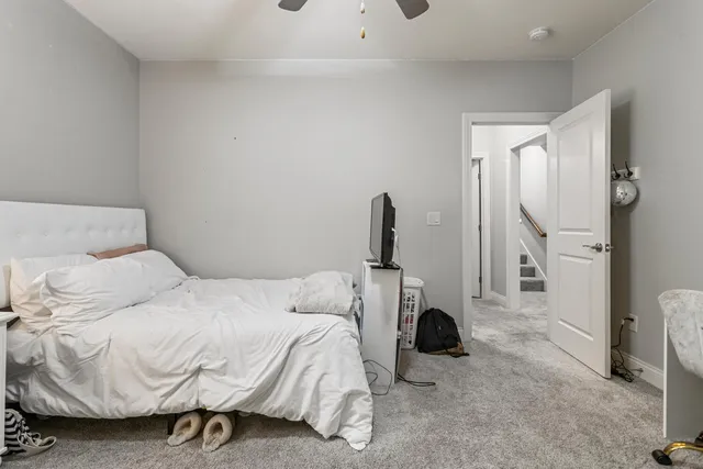 a bedroom with a bed and a couch